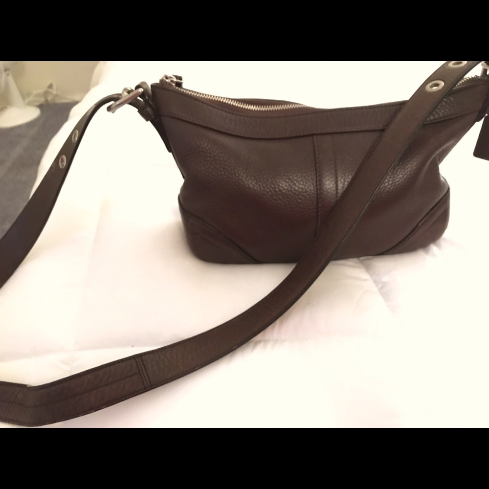 Dark brown Coach shoulder/crossbody bag.